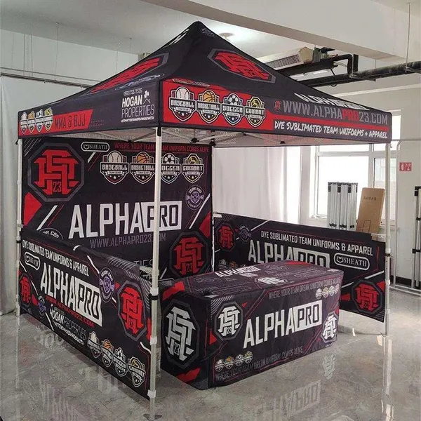 Custom printed black and red 10x10 canopy tent with branded backwall and table cover for AlphaPro
