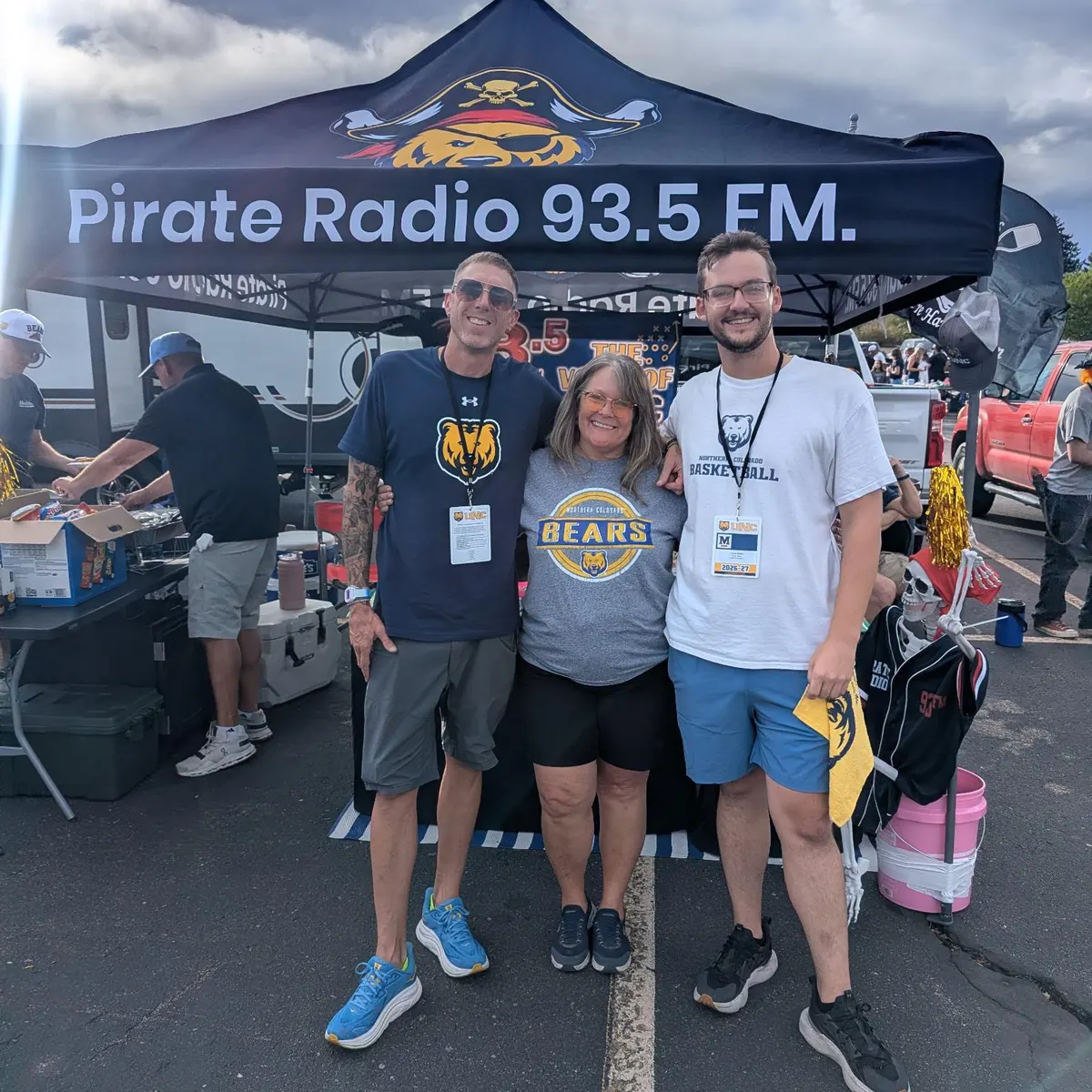 Pirate Radio 93.5 FM custom black pop-up canopy tent with full-color printed logo at a tailgate event